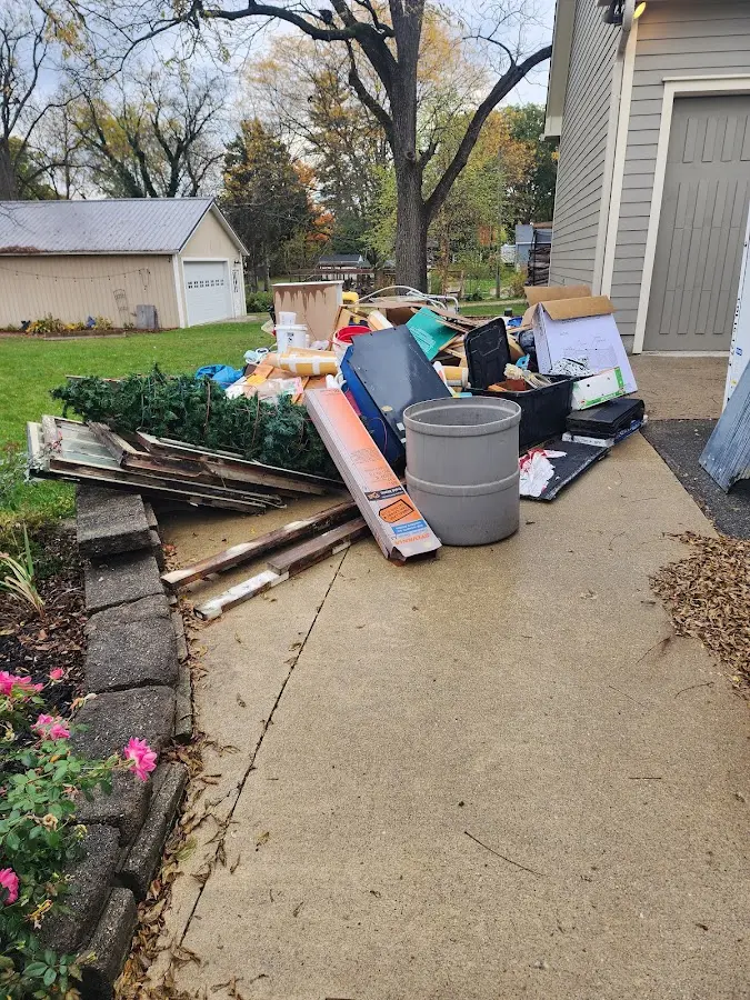 Dumpster being loaded with debris for 3 Yard Dumpster Rental in Lincoln Village